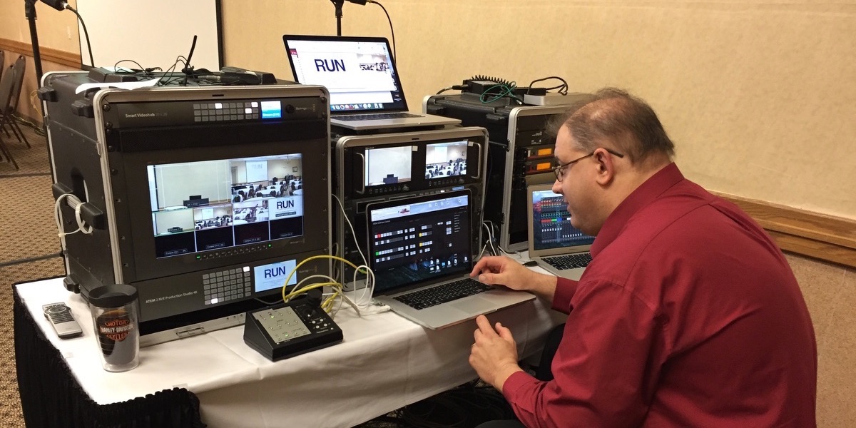 Our staff equipped an empty conference room with microphones, cameras and projection to
                    support this popular event off-campus, and send it across the state to remote viewing locations.